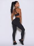 Side profile highlights the smooth, medium-weight fabric and non-slip leg band on these black shorts