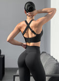 Back profile view of our model in outdoor wearing the Curves Leggings in Black color
