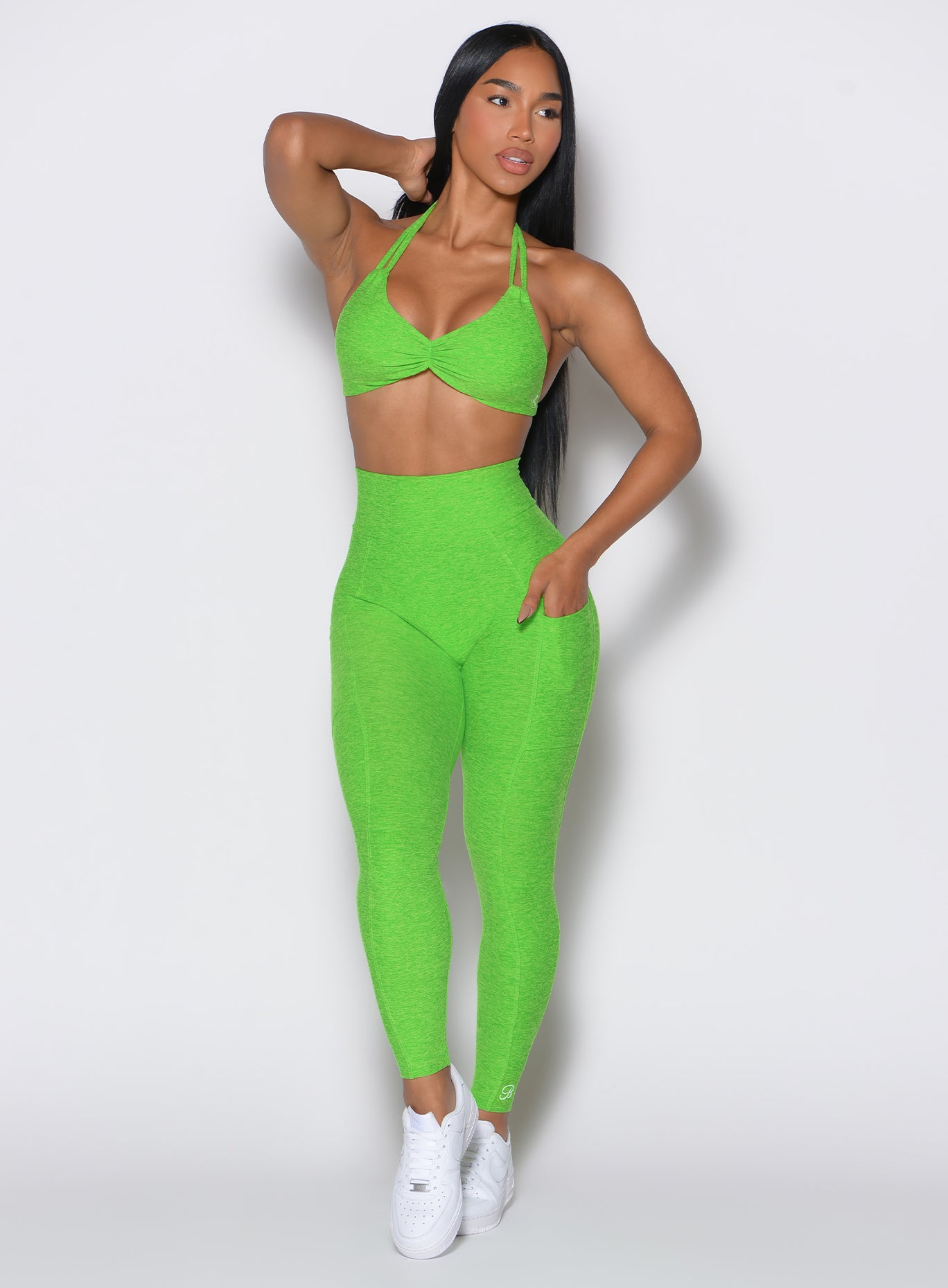 High-waisted neon lime green Curves Leggings with side pockets and a sculpting scrunch booty.