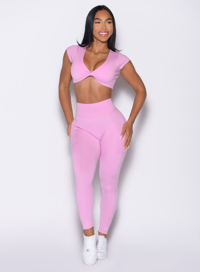 front profile view of a model looking to the left side wearing the Define Leggings in Lilac Chiffon color
