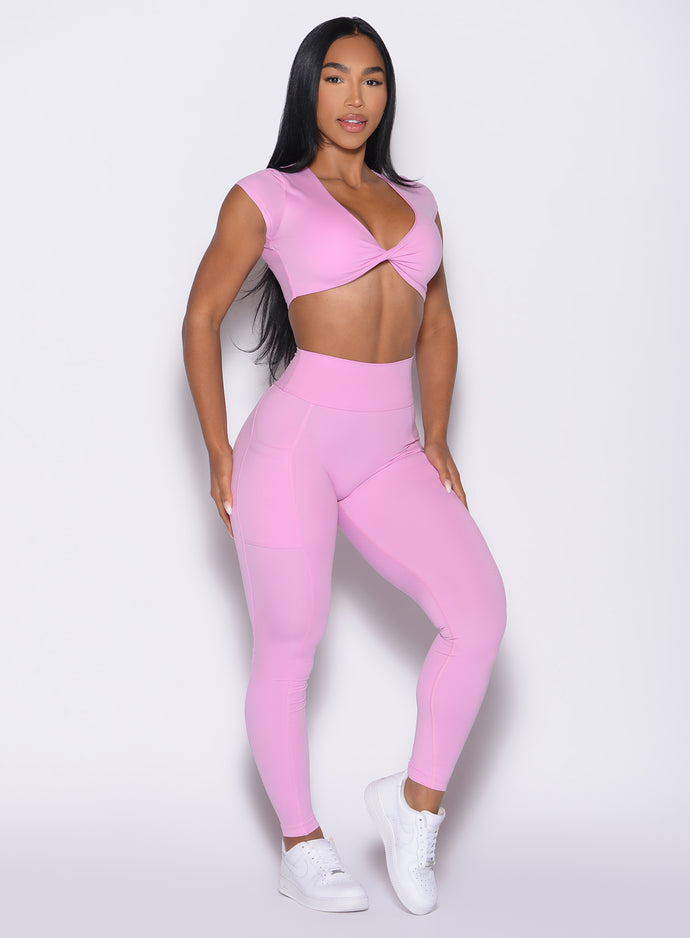 front right side profile view of a model wearing the Define Leggings in Lilac Chiffon color