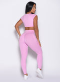 back right side profile view of a model wearing the Define Leggings in Lilac Chiffon color