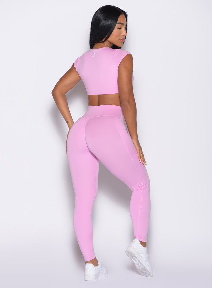 back right side profile view of a model wearing the Define Leggings in Lilac Chiffon color