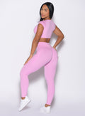 back left side profile view of a model looking over her shoulder wearing the Define Leggings in Lilac Chiffon color