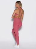 back profile view of a model wearing the Define Leggings in primrose color