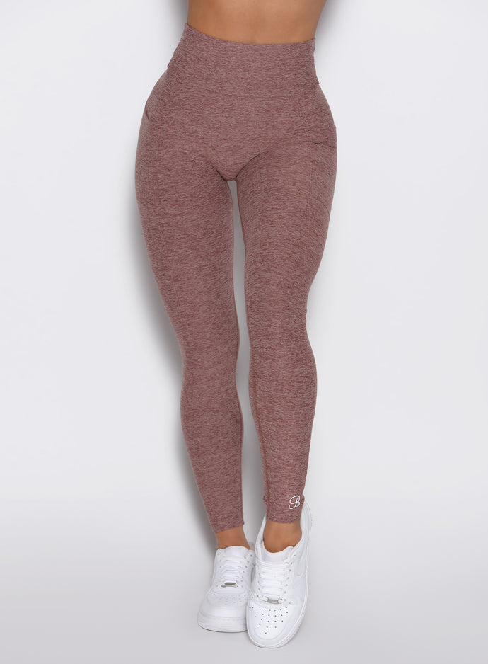 close up front view of a model wearing the Define Leggings in walnut color
