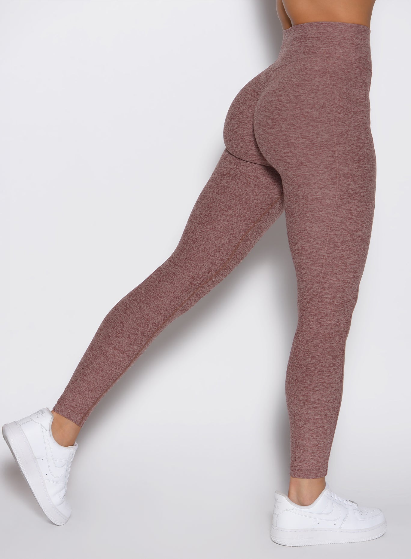 back right side profile view of a model wearing the Define Leggings in walnut color