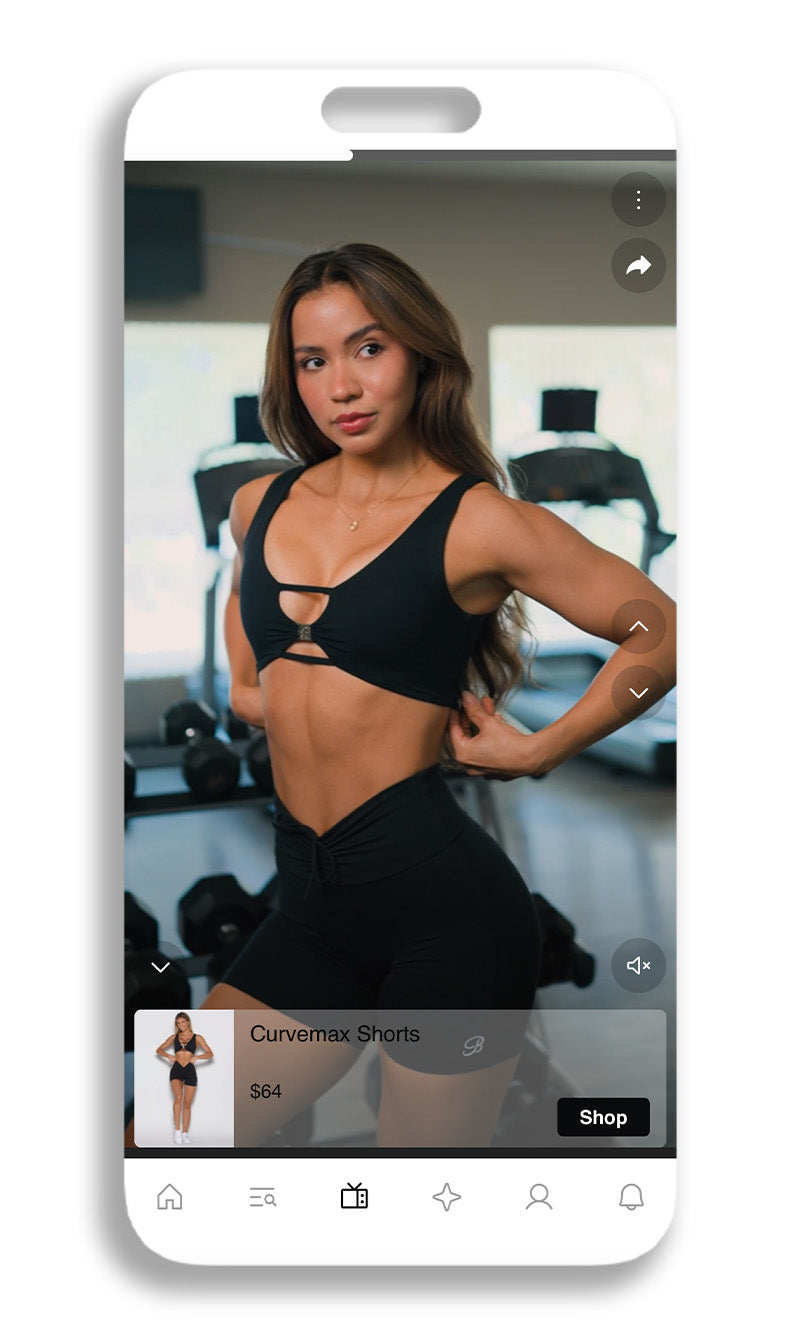 A smartphone mockup displaying a fitness model wearing black cutout shorts and a black sports bra in a gym setting, with a shopping overlay for 'Curvermax Shorts'.