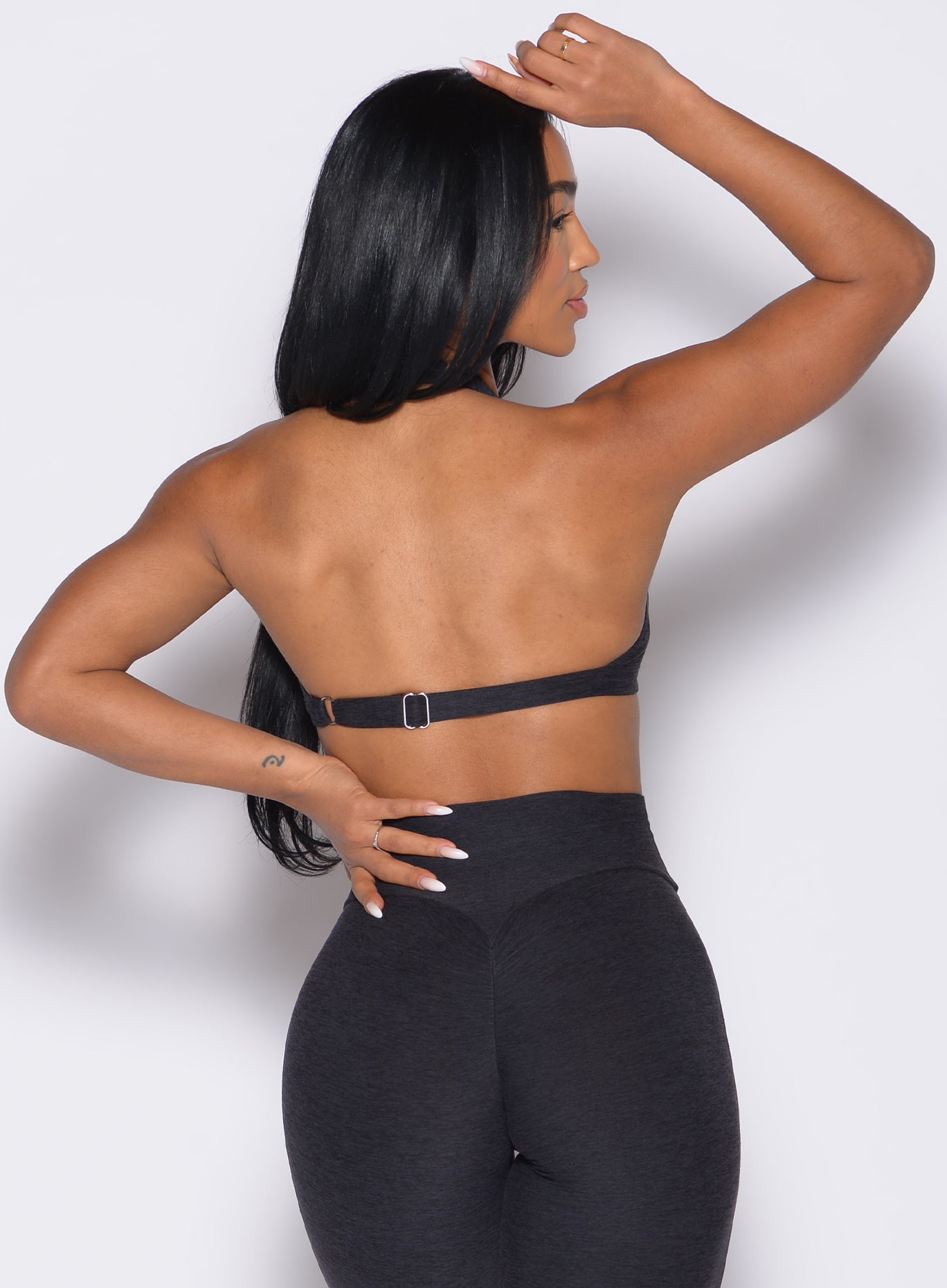 Heathered Black Iron Edge Bra featuring a keyhole cutout and open back for elite gym performance.