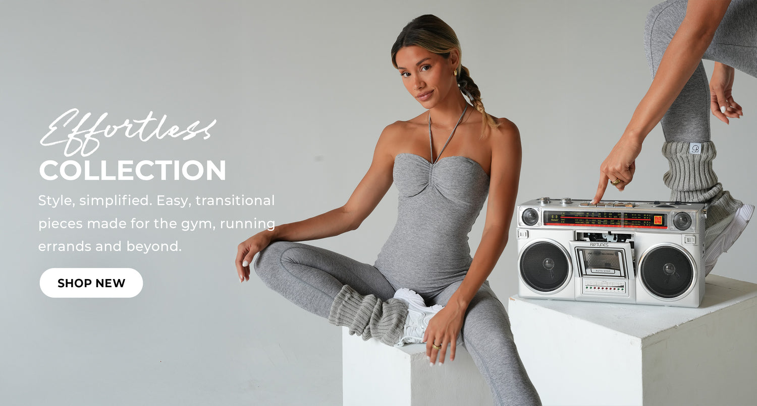 "Effortless Collection" banner with a model in a grey halter bodysuit and leggings, sitting beside a vintage boombox. Bold text: "Effortless Collection." Subtext reads "Style, simplified. Easy, transitional pieces made for the gym, running errands and beyond." CTA button reads "Shop New."