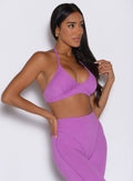 front right side profile view of a model looking to the left side wearing the Electric Era Bra in Purple rain color