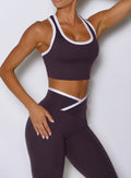 close up front view of a model wearing the Finish Line Tank in black orchid color