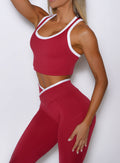 close up front left side shot of a model wearing the Finish Line Tank in maroon color