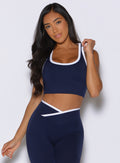 front view of a model wearing the Finish Line Tank in navy color