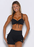 frontal perspective of a model wearing the FitBoost Bra in Black color