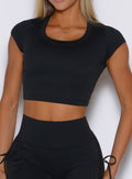 close up front view of a model wearing the FitBoost Tee in Black color