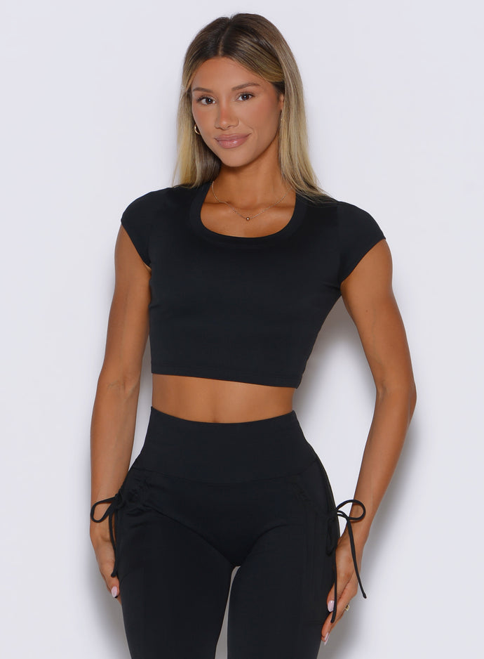 frontal shot of a model wearing the FitBoost Tee in Black color