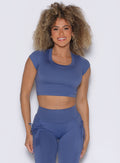 frontal view of a model wearing the FitBoost Tee in Blue slate color