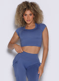 front profile view of a model wearing the FitBoost Tee in Blue slate color