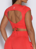 close up back profile view of a model wearing the FitBoost Tee in Command red color