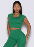 front profile view of a model wearing the FitBoost Tee in Field green color