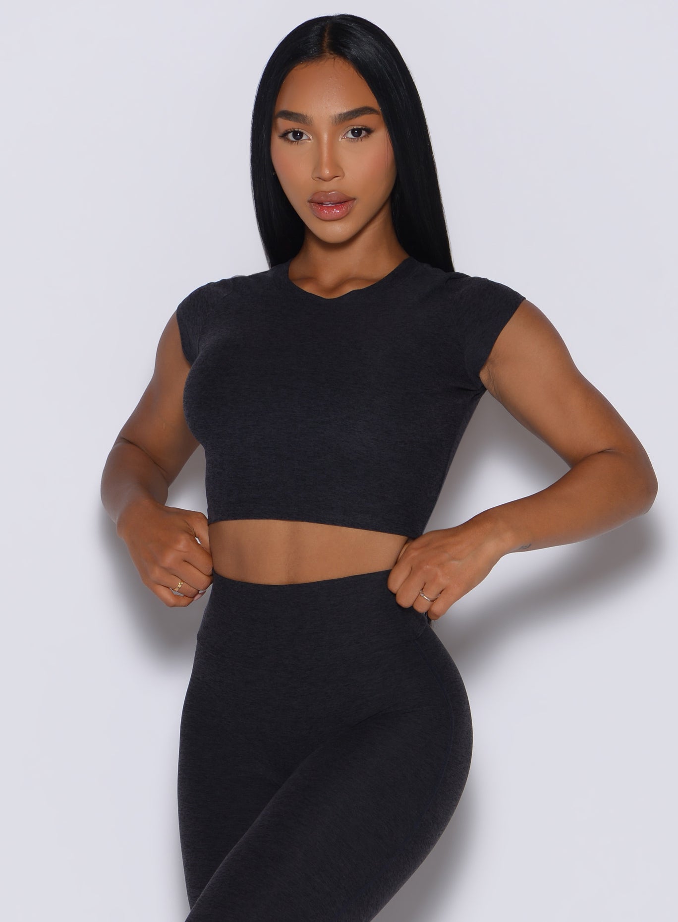Heathered Onyx Fit Fam Active Tee with cap sleeves and a round neck for versatile gym styling.