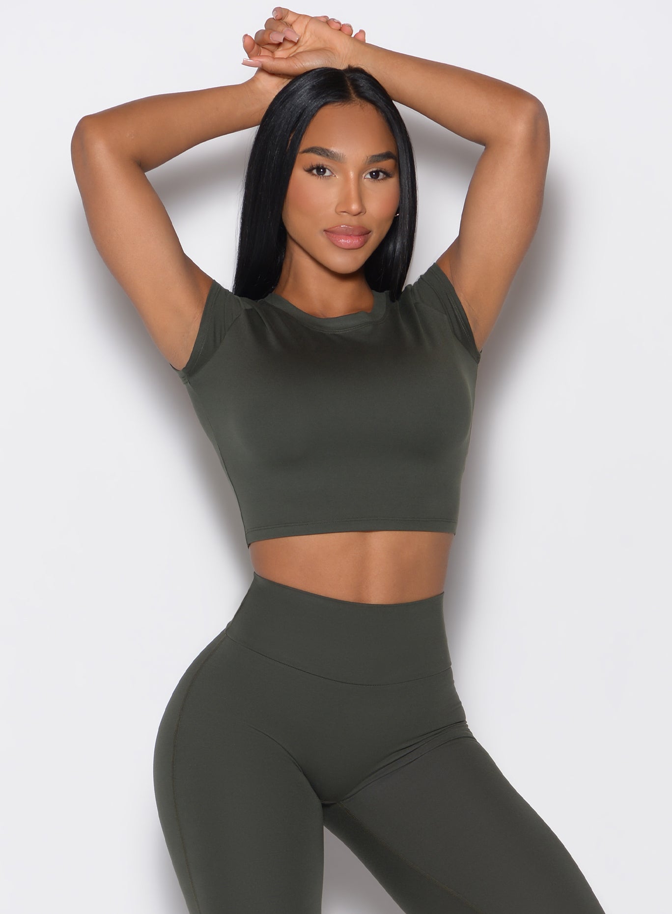 Deep Ivy Fit Fam Active Tee featuring capped sleeves and a round neck for a sculpting gym look.