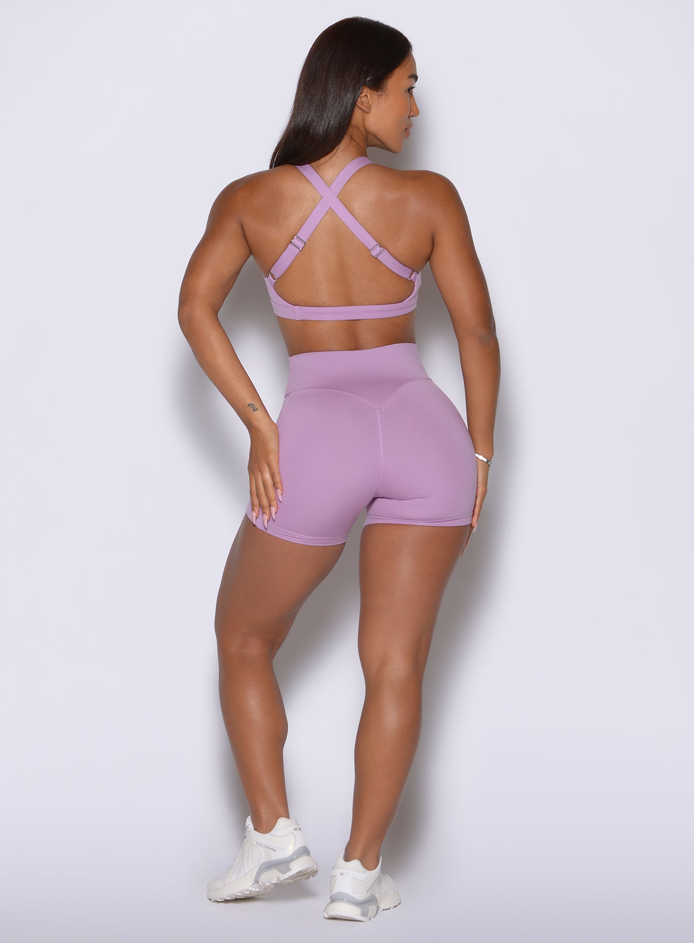 Curved sweetheart booty-enhancing stitching shapes the rear of these Smokey Grape active shorts