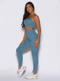Front left side profile of Baby Blue Cheetah Fit Leggings; high-waisted sculpting gym activewear.