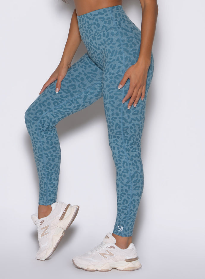 Baby Blue Cheetah Fit Leggings with high-waisted sculpting fit and side pocket detail.