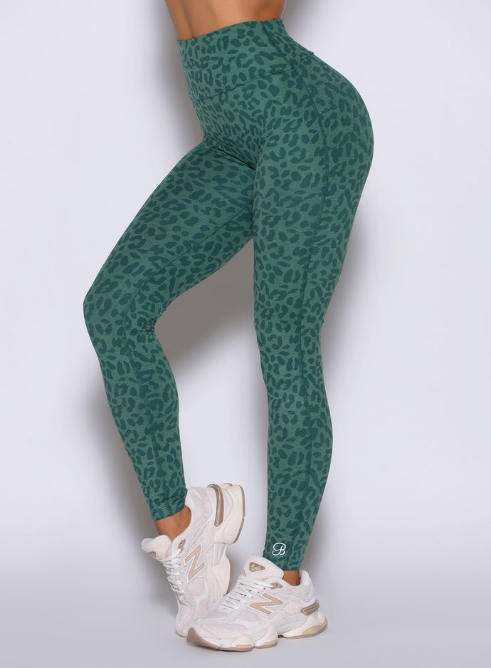 Close-up left side profile of Emerald Green Cheetah Fit Leggings with internal sculpting scrunch.