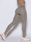 Nori Cheetah Fit Leggings in a close-up right side profile view, showcasing a sculpting gym fit.