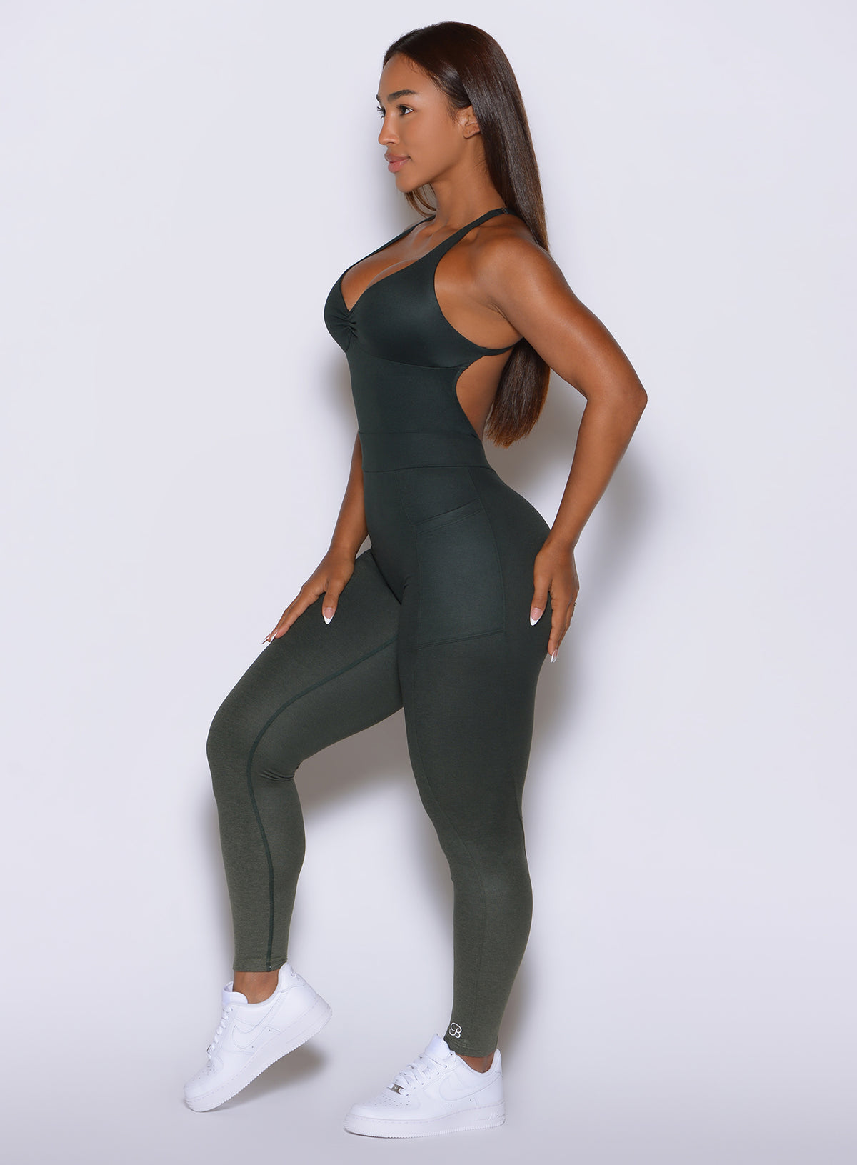 Moisture-wicking fitness bodysuit in Ombre Fern offering a smooth, second-skin supportive fit.