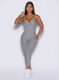 model viewed from the front wearing the flawless form bodysuit in dark and stormy color