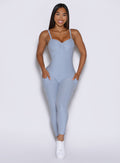 a model captured from the front wearing the flawless form bodysuit in niagara mist color