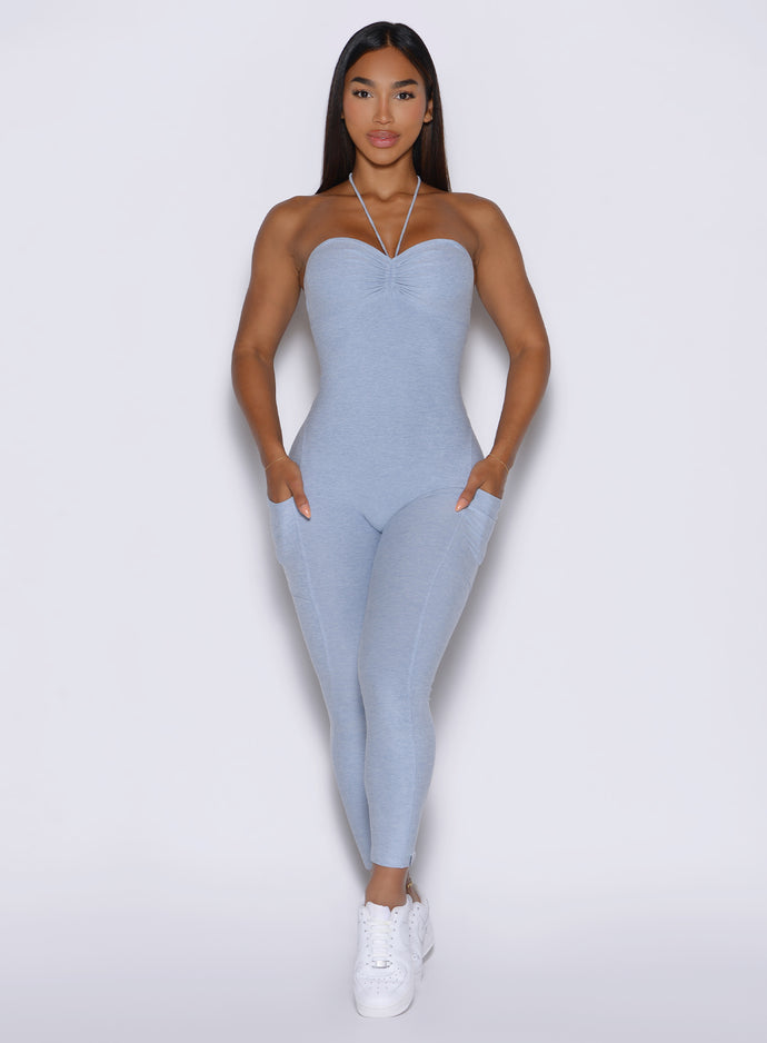 front profile view of a model wearing the flawless form bodysuit in Niagara mist color