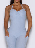 crisp and close front view of a model wearing the flawless form bodysuit in niagara mist color