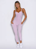 model captured from the front wearing the flawless form bodysuit in pink paloma color