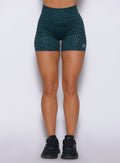 Front close-up of Flexfit Ocean Teal Cheetah shorts highlighting a supportive high-rise fit.