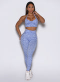 Front profile view of the model wearing our Flexfit leggings in Leopard Baby Lavender paired with a matching top.