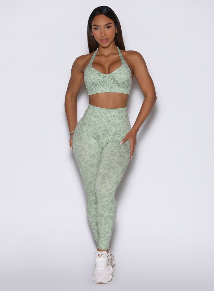 Front view showcasing the model in Leopard Cool Matcha Flexfit leggings and a matching bra.