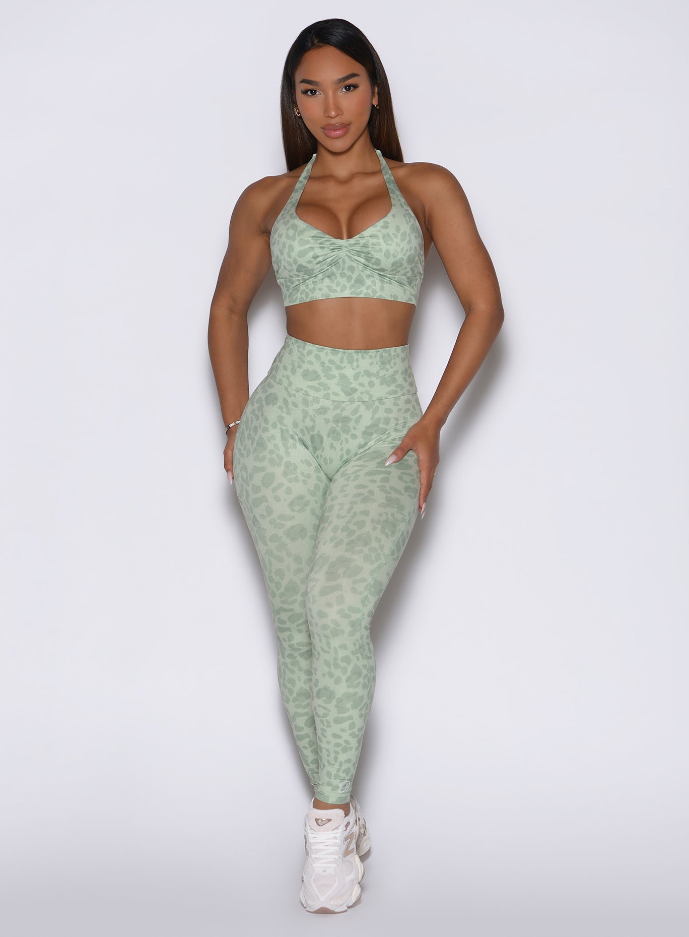 Front view showcasing the model in Leopard Cool Matcha Flexfit leggings and a matching bra.