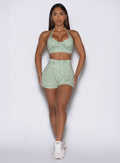 Front-facing profile of the model in Leopard Cool Matcha Flexfit shorts paired with a matching bra.