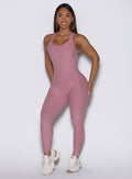 front profile view of a model wearing the Form Bodysuit in Rose/Blush color