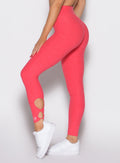 close up left side view of a model wearing the Form Flex Leggings in watermelon punch color
