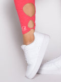 close up view of the ankle showcasing the detailed ankle design on the Form Flex Leggings in watermelon punch color