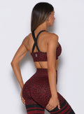 Side view of the Black Cherry Cheetah Glow Sports Bra showcasing smooth coverage and mobility