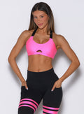 Neon Pink Glow Sports Bra featuring a front keyhole cutout and supportive elastic straps.