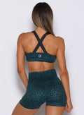 Ocean Teal Cheetah Glow Sports Bra with an adjustable back design and supportive performance fit