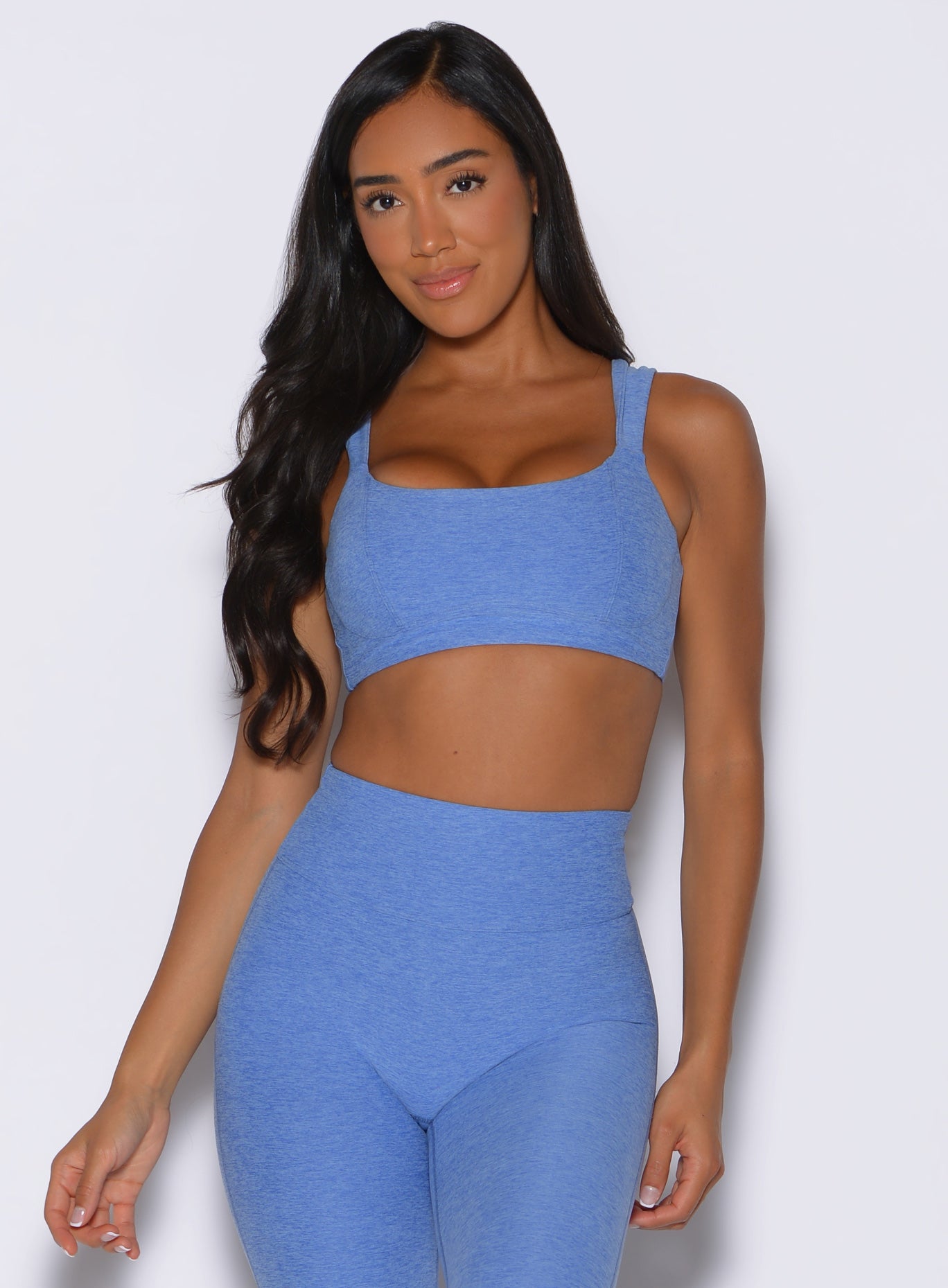 model wearing the halo sports bra in boss blue color captured from the front 